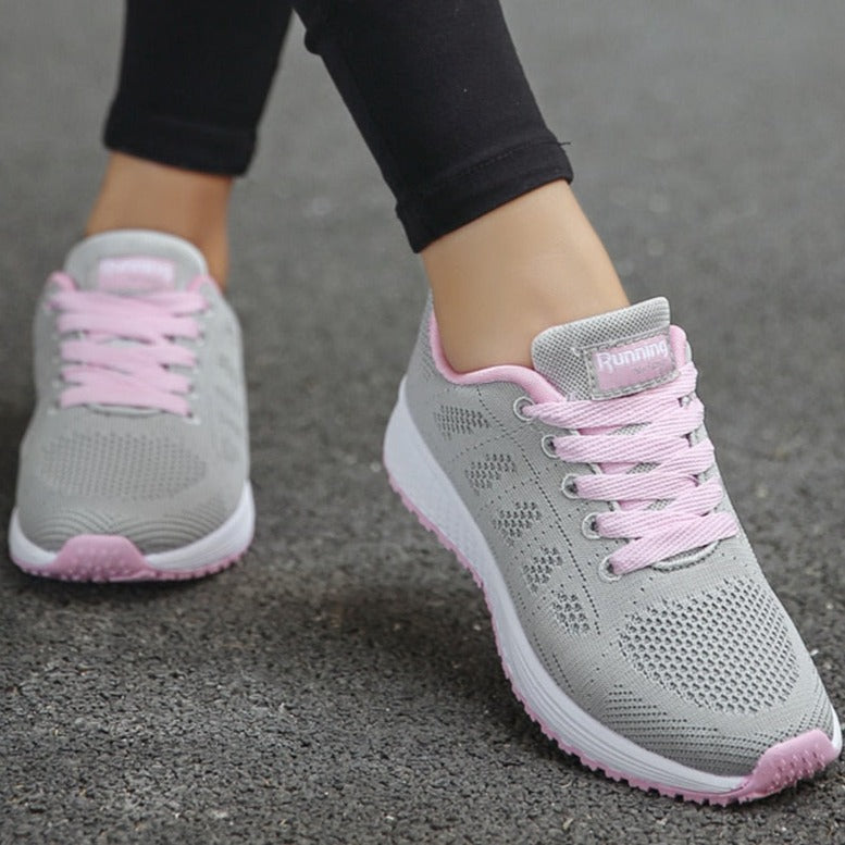 Supportive women's sneakers for walking, designed to reduce foot fatigue & enhance comfort.