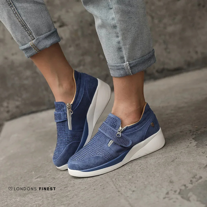 Lightweight women's walking shoes with adjustable strap, cushioned arch support, and foot health benefits.