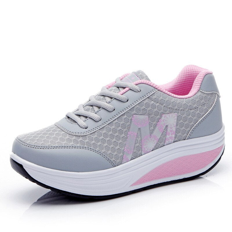 Women's active wear sneakers, breathable and supportive for daily walking comfort.