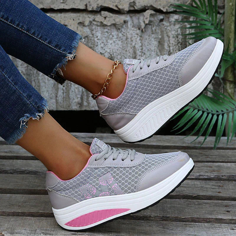 Everyday women's walking sneakers with arch support, breathable fabric, and cushioned comfort.