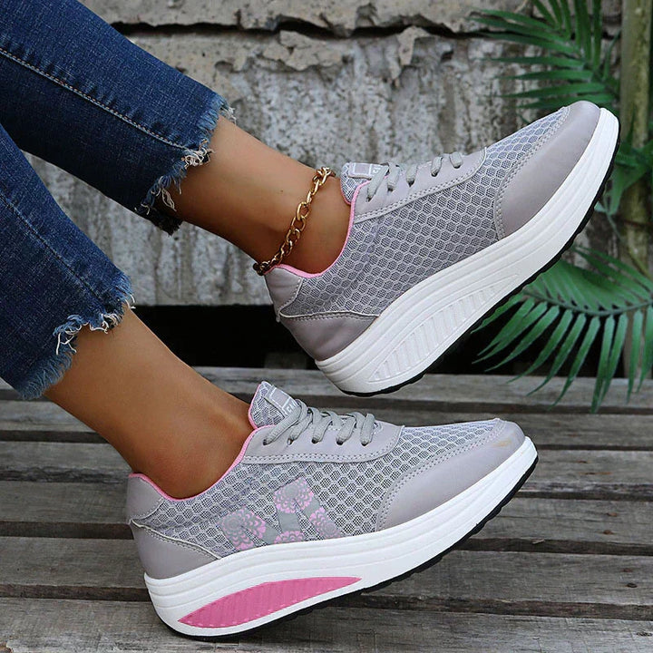 Everyday women's walking sneakers with arch support, breathable fabric, and cushioned comfort.