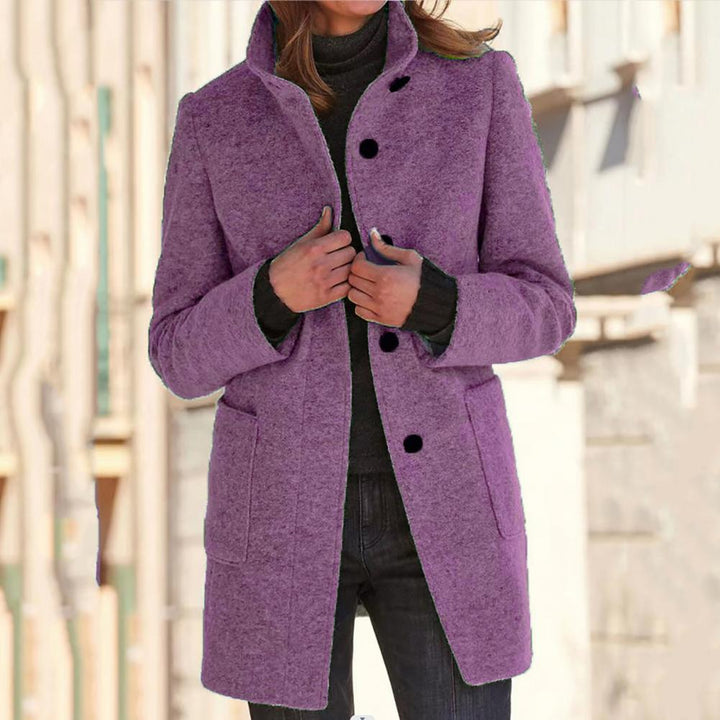 Classic fit women's tailored coat, mid-length, with sophisticated button detail. A must-have for fall outerwear.