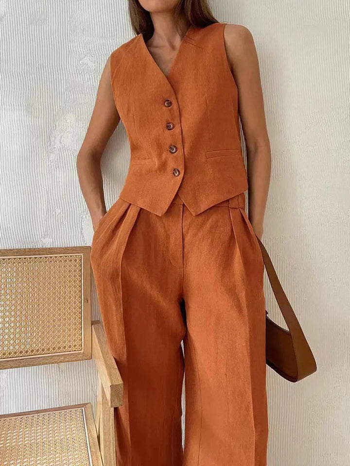 Chic women's matching tailored waistcoat and wide leg trouser set. A versatile two-piece for elegant smart casual fashion.
