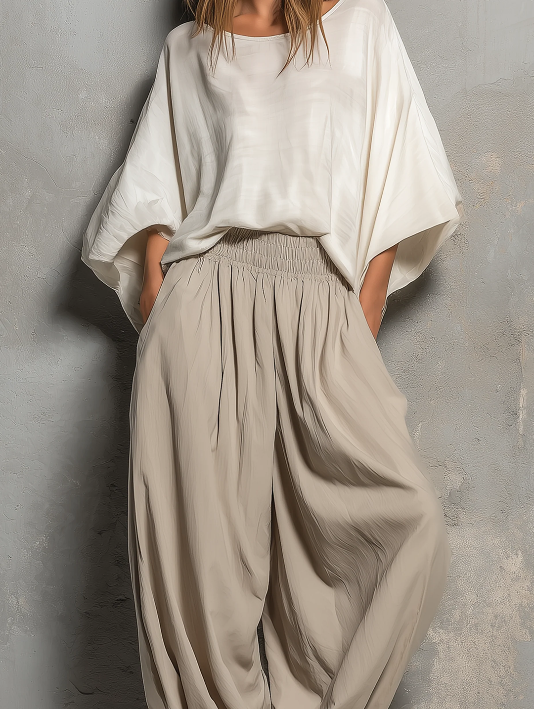 Relaxed fit taupe women's harem pants. High waist, wide leg, & soft fabric offer ultimate comfort for daily wear.