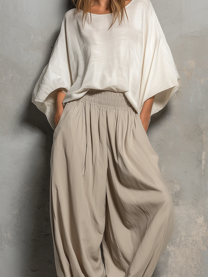 Relaxed fit taupe women's harem pants. High waist, wide leg, & soft fabric offer ultimate comfort for daily wear.