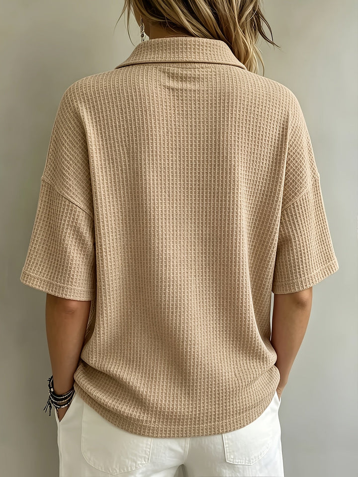 Stylish women's polo shirt, textured fabric & relaxed fit, perfect for fall outfits.