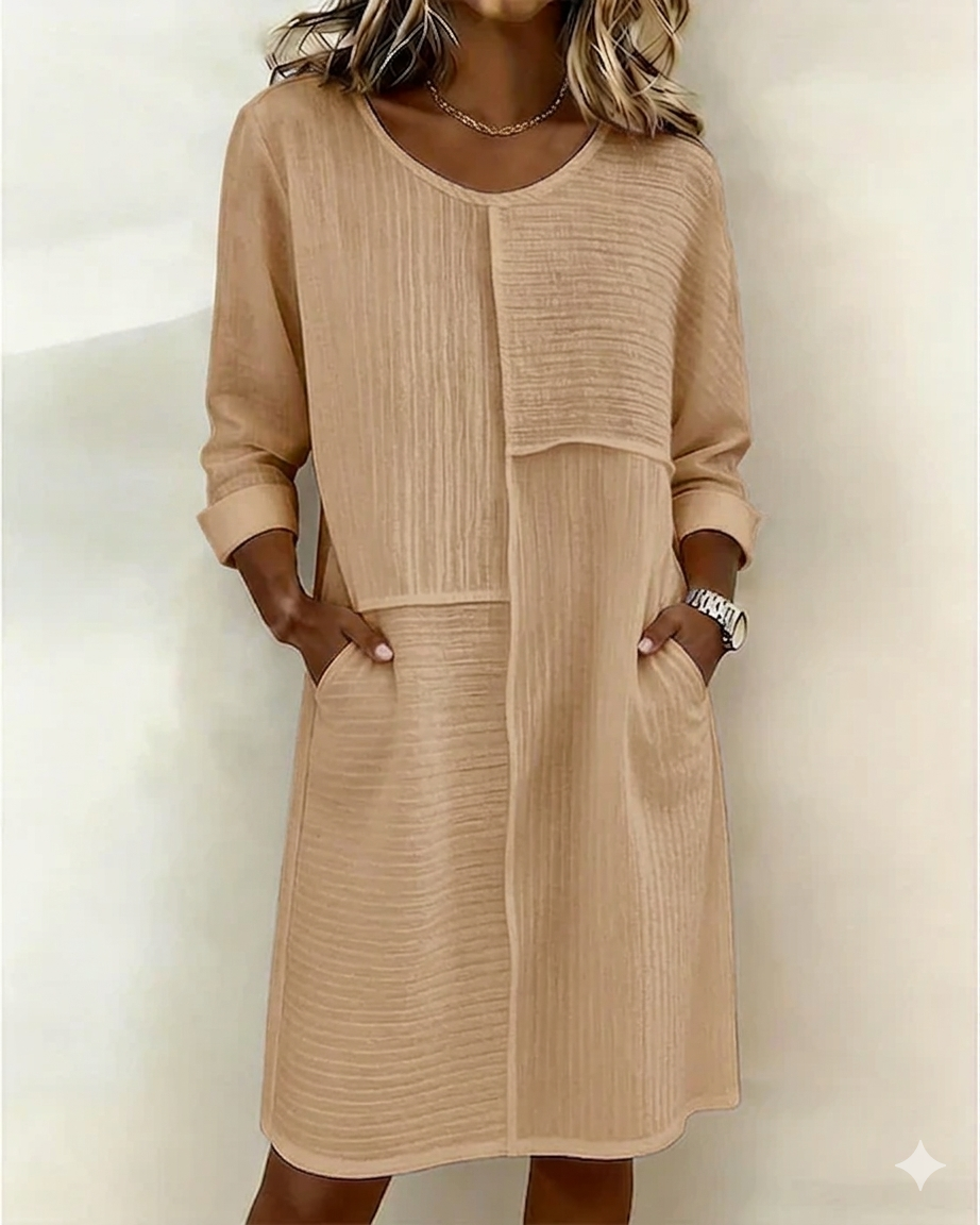 Modest women's relaxed fit textured shift dress. Enjoy all-day comfort with practical pockets and 3/4 sleeves.