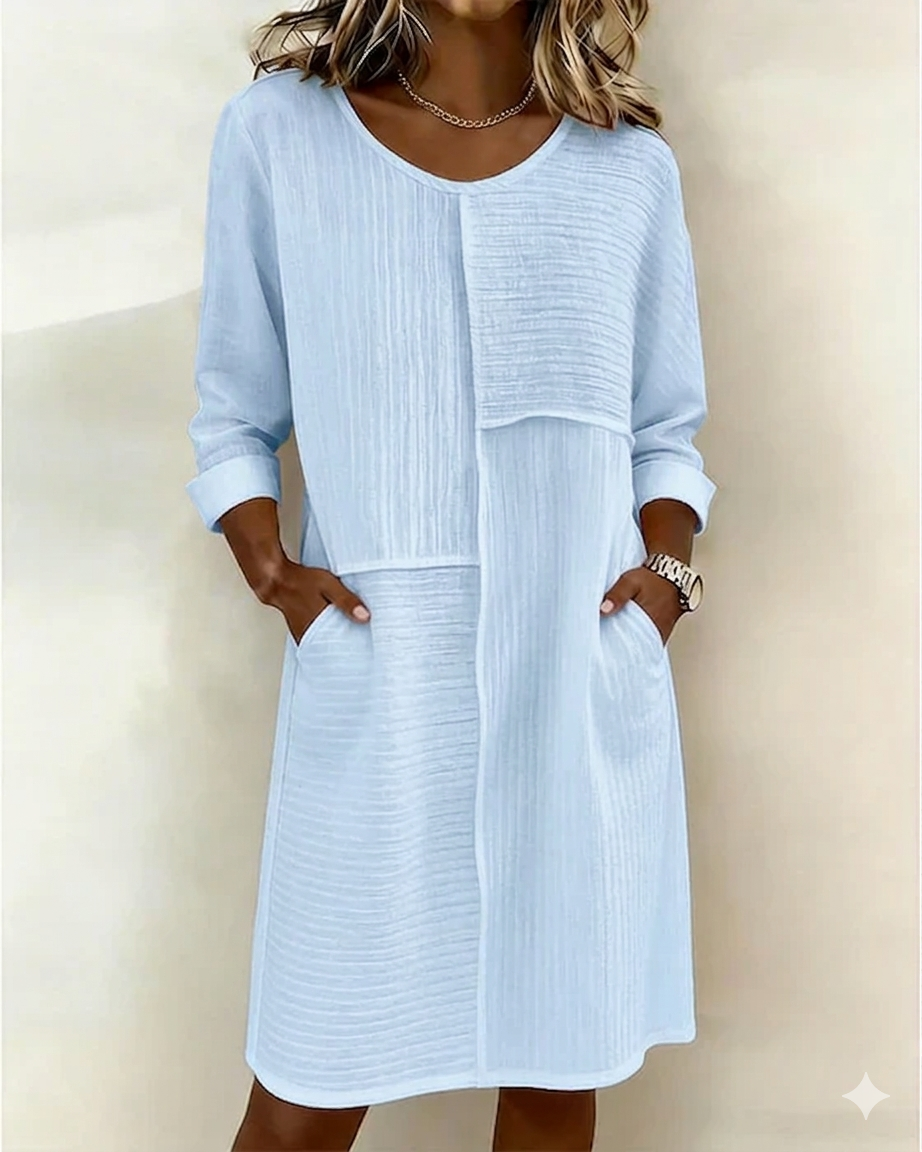 Women's textured shift dress with pockets & 3/4 sleeves. Casual, comfortable, and chic for spring & summer days.