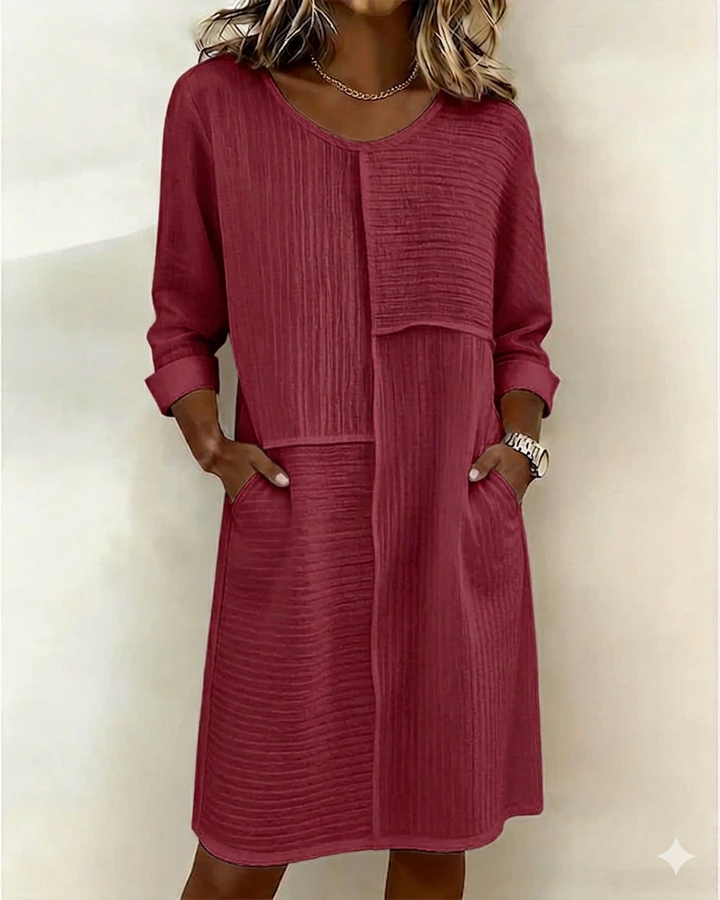 Effortless women's textured shift dress offers all-day comfort, with pockets for a relaxed, chic look.