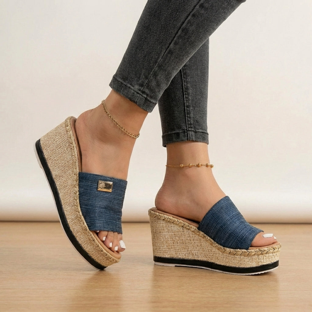 Fashionable women's espadrille wedge sandals with a textured strap, ideal open-toe summer shoes.