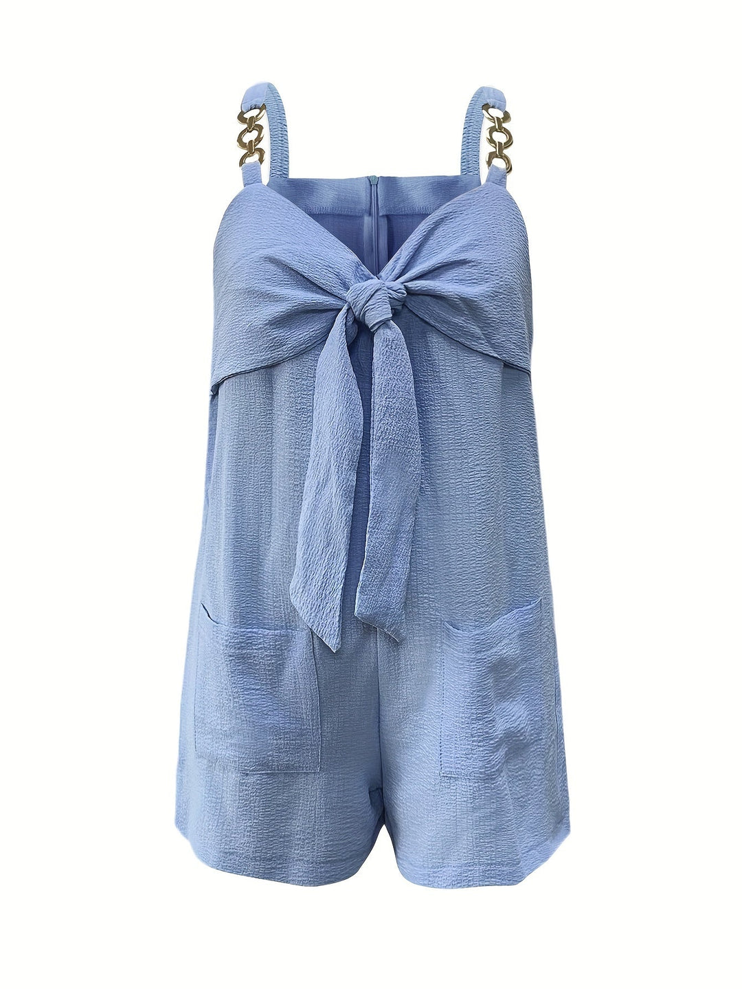 Women's textured sweetheart romper with chain straps styled with accessories for a complete party outfit.