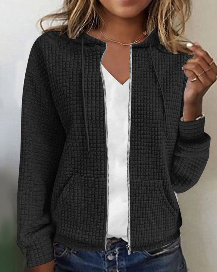 Comfortable women's textured zip-up hoodie. Perfect hooded jacket for casual layering with practical pockets.