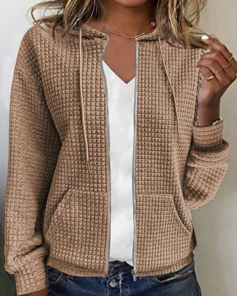Pink women's textured zip-up hoodie jacket. Versatile hooded top with front pockets for casual everyday wear.