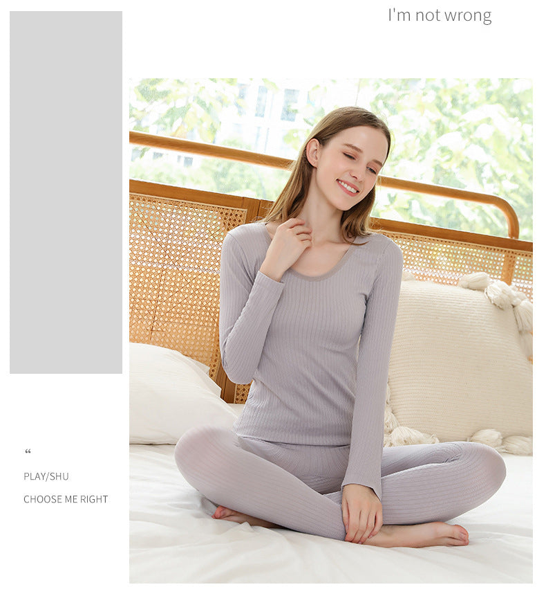 Shaping women's thermal base layer set for a sleek silhouette under clothing.