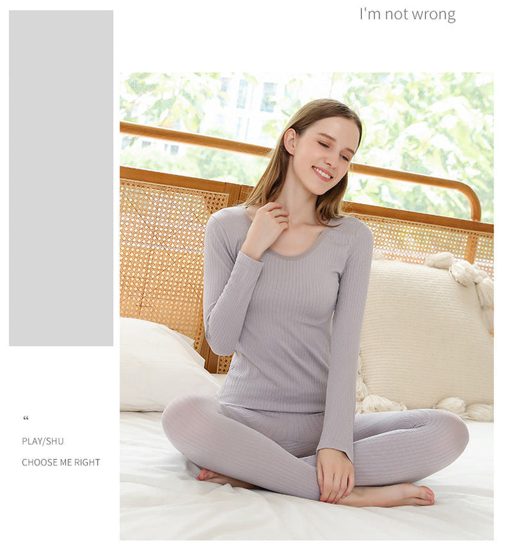 Shaping women's thermal base layer set for a sleek silhouette under clothing.