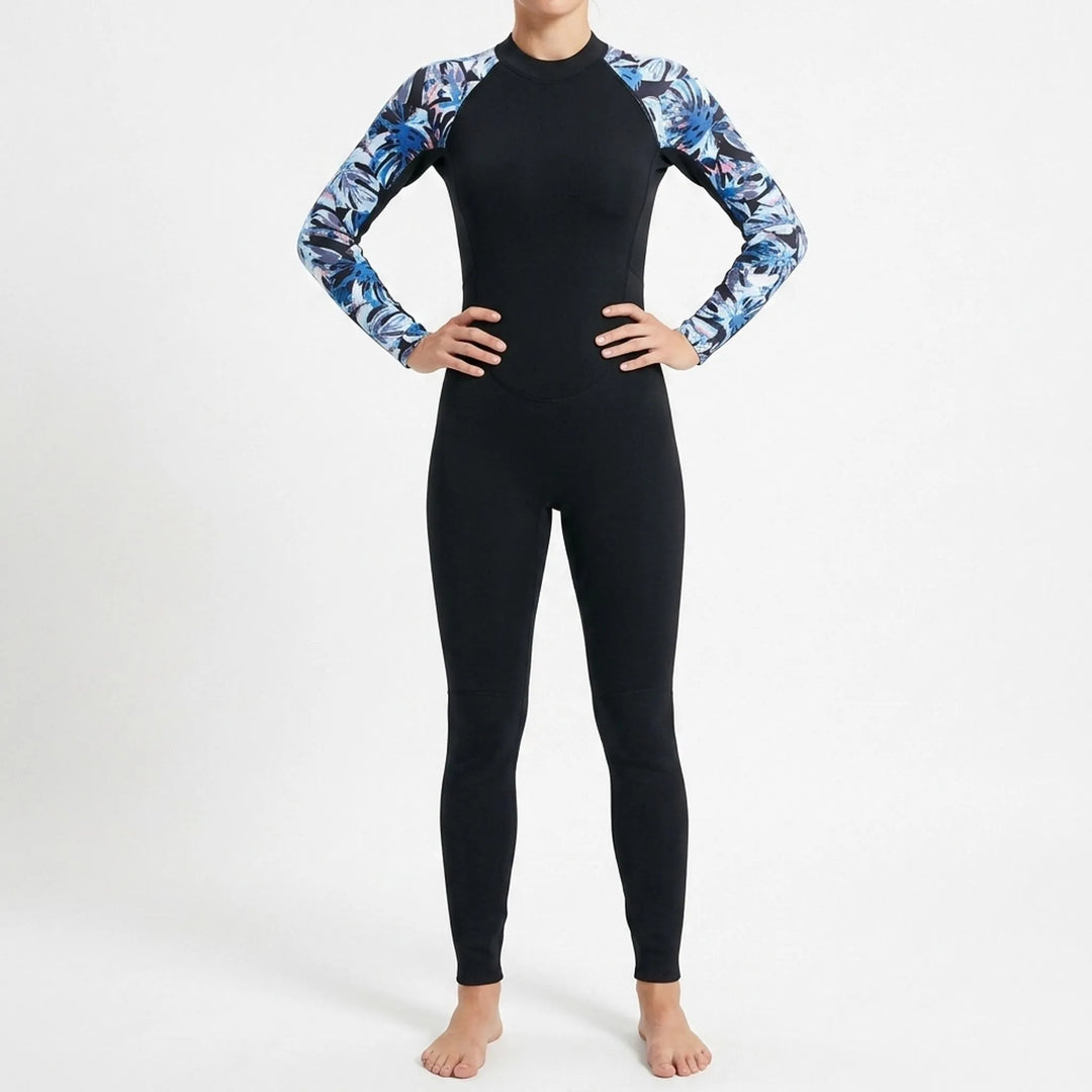 Patterned long-sleeve women's full-body wetsuit provides thermal protection for water sports & surfing.