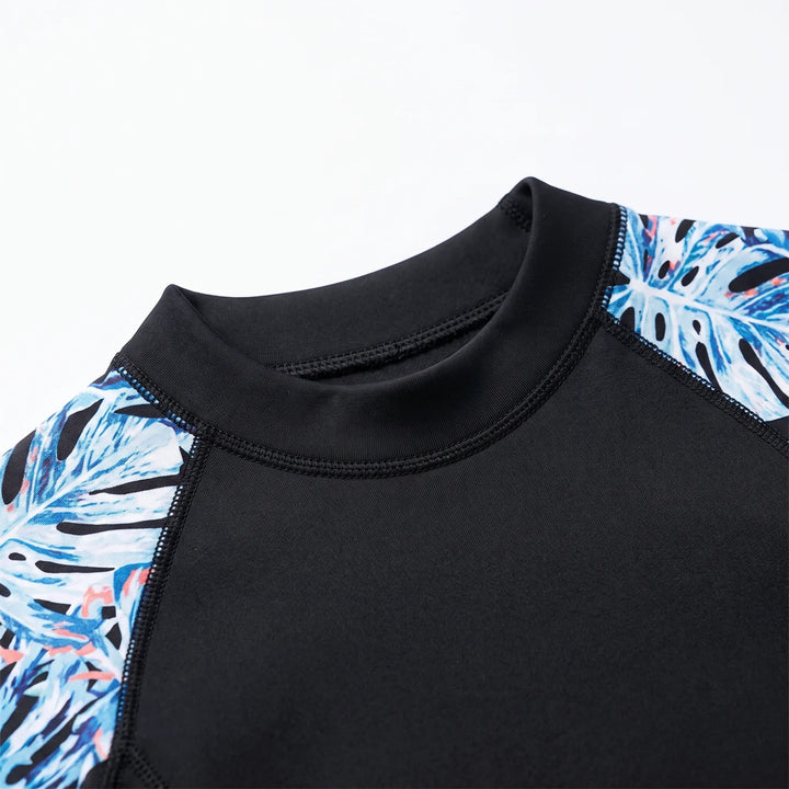Active women's one-piece thermal full-body wetsuit for cold water. Offers warmth for swimming, surfing, diving.