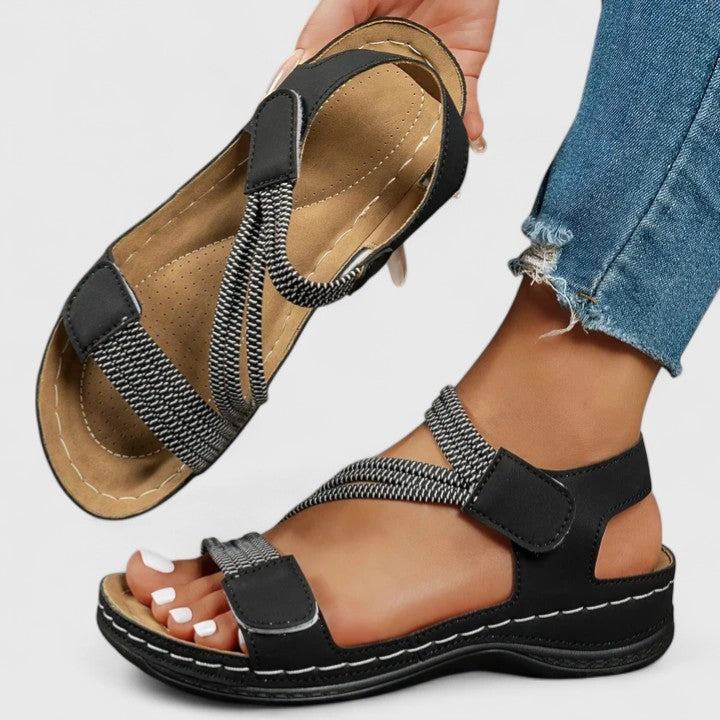 Durable women's orthopedic sandals with robust three-arch support sole for lasting comfort.