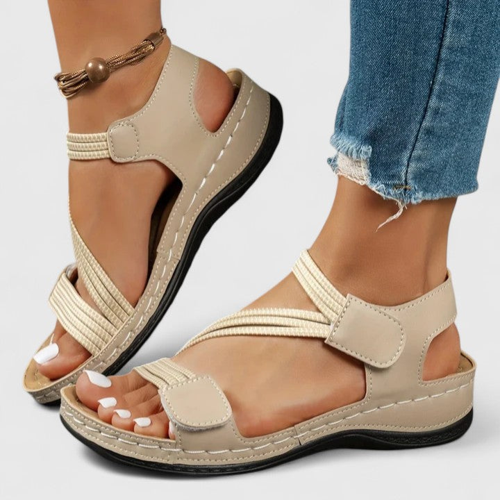Supportive women's walking sandals with three-arch technology, providing all-day foot pain relief.