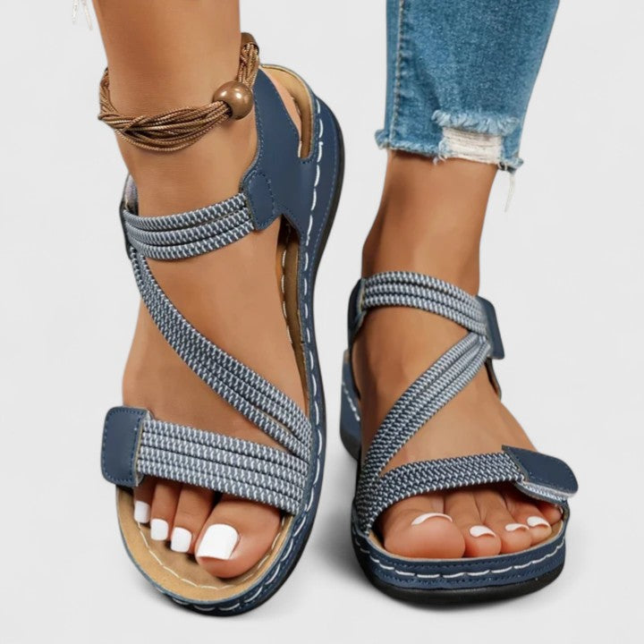 Side view of women's orthopedic sandals, showcasing ergonomic design for flat feet & posture.