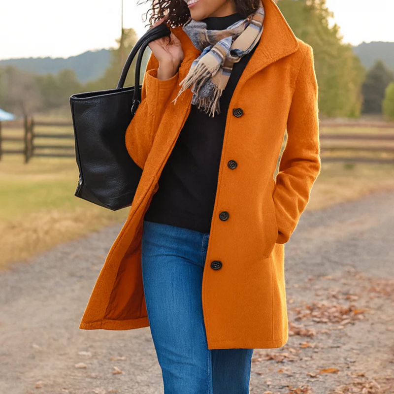 Classic women's button-up coat. Long sleeve, elegant outerwear for timeless fall and winter fashion.