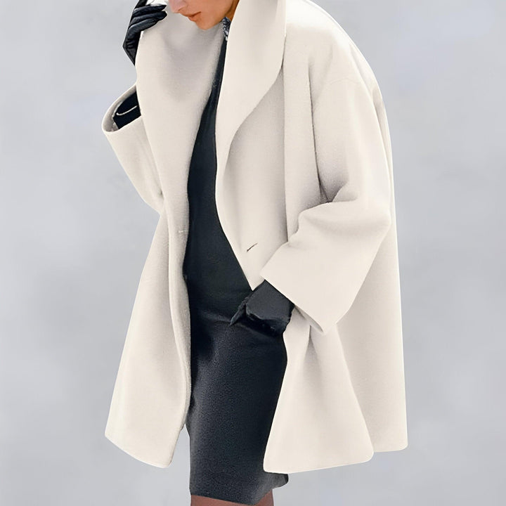 Oversized women's long coat. An elegant layering piece, providing timeless style for office wear or casual outings.