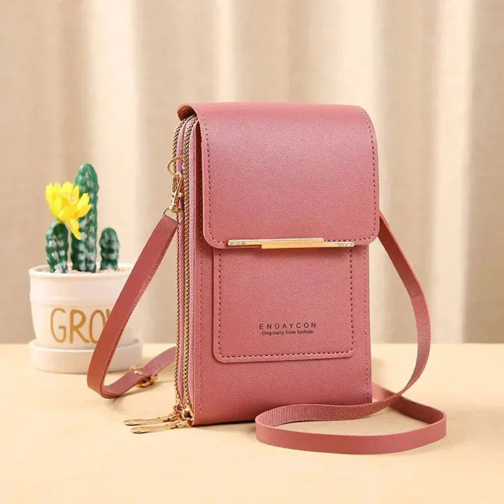 Stylish women's crossbody phone bag featuring a touch screen window. Keeps your phone accessible & essentials organized.