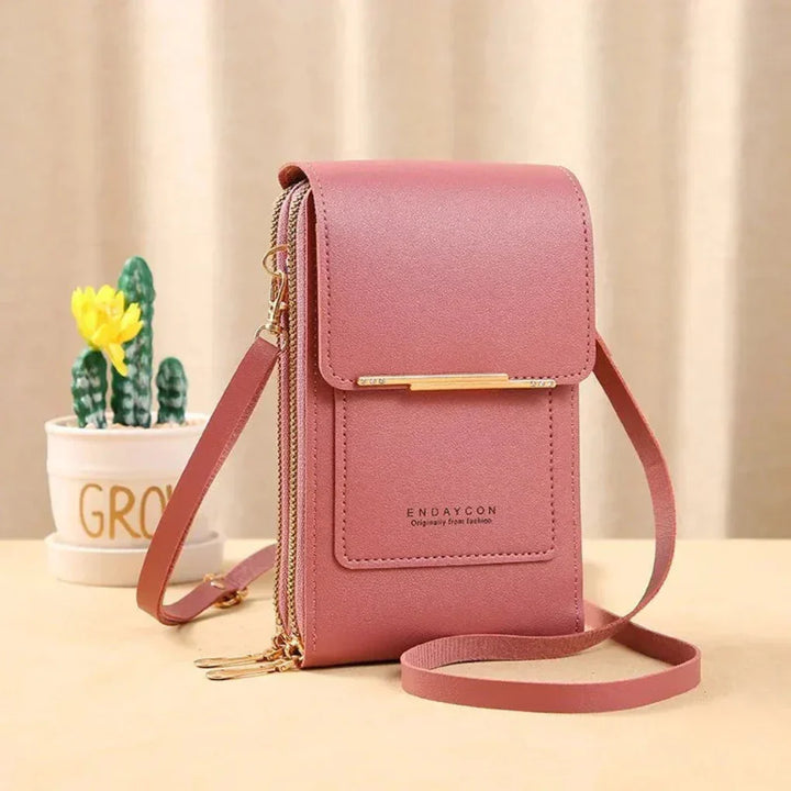Stylish women's crossbody phone bag featuring a touch screen window. Keeps your phone accessible & essentials organized.