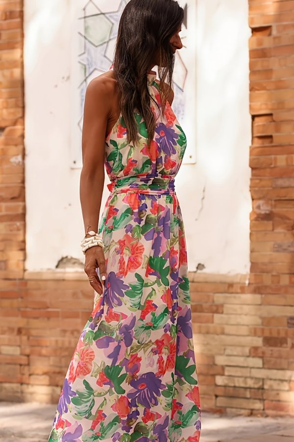 Women's resort wear maxi dress, tropical floral print, halter neck, keyhole detail.