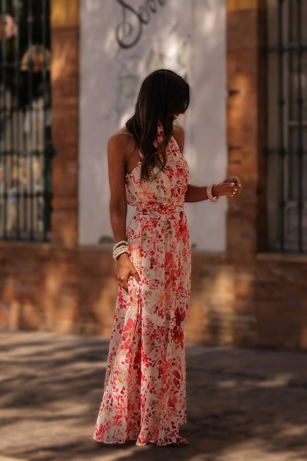 Chic tropical maxi dress for women, comfortable halter neck, keyhole, vibrant floral pattern.