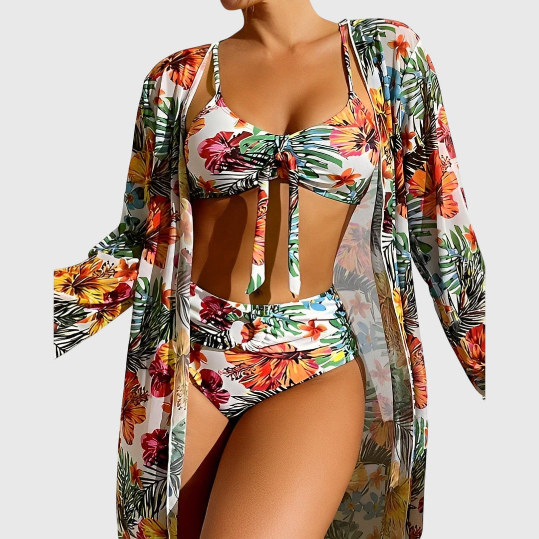 Vibrant tropical floral print two-piece swimsuit for women, a stylish and flattering summer beach outfit.