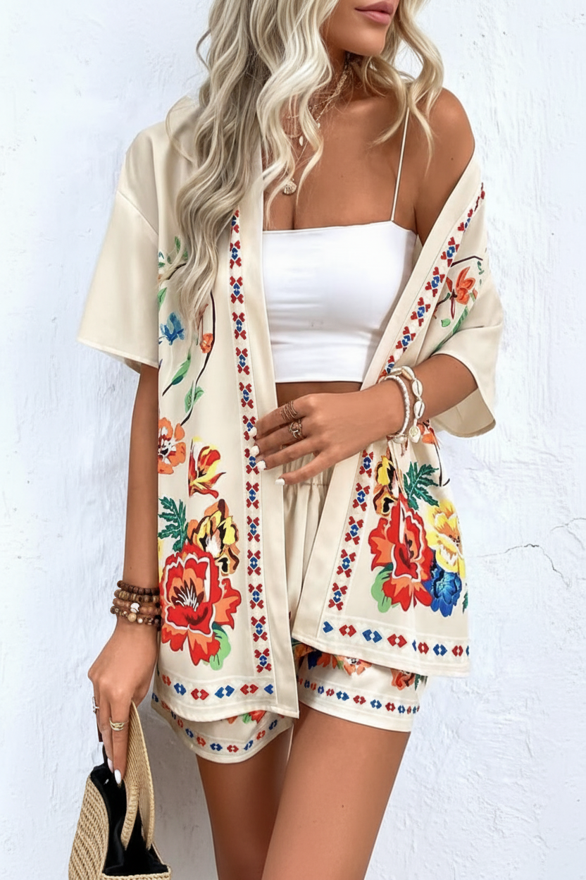 Women's tropical floral print two-piece summer set. Short sleeve top and matching shorts, ideal for beach & resort wear.