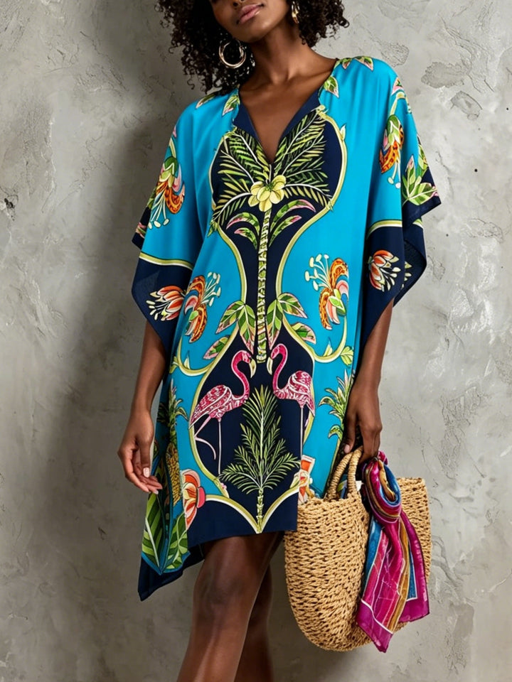 Women's tropical print V-neck kaftan midi dress with elegant batwing sleeves, perfect for resort wear.