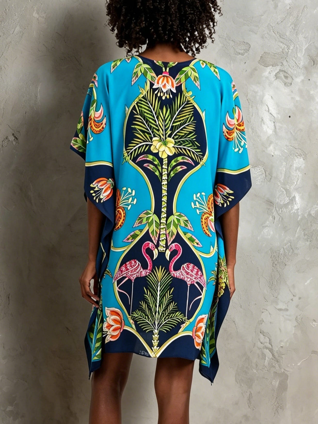 Flowy tropical kaftan midi dress for women, featuring a V-neck and batwing sleeves, ideal for summer vacation.