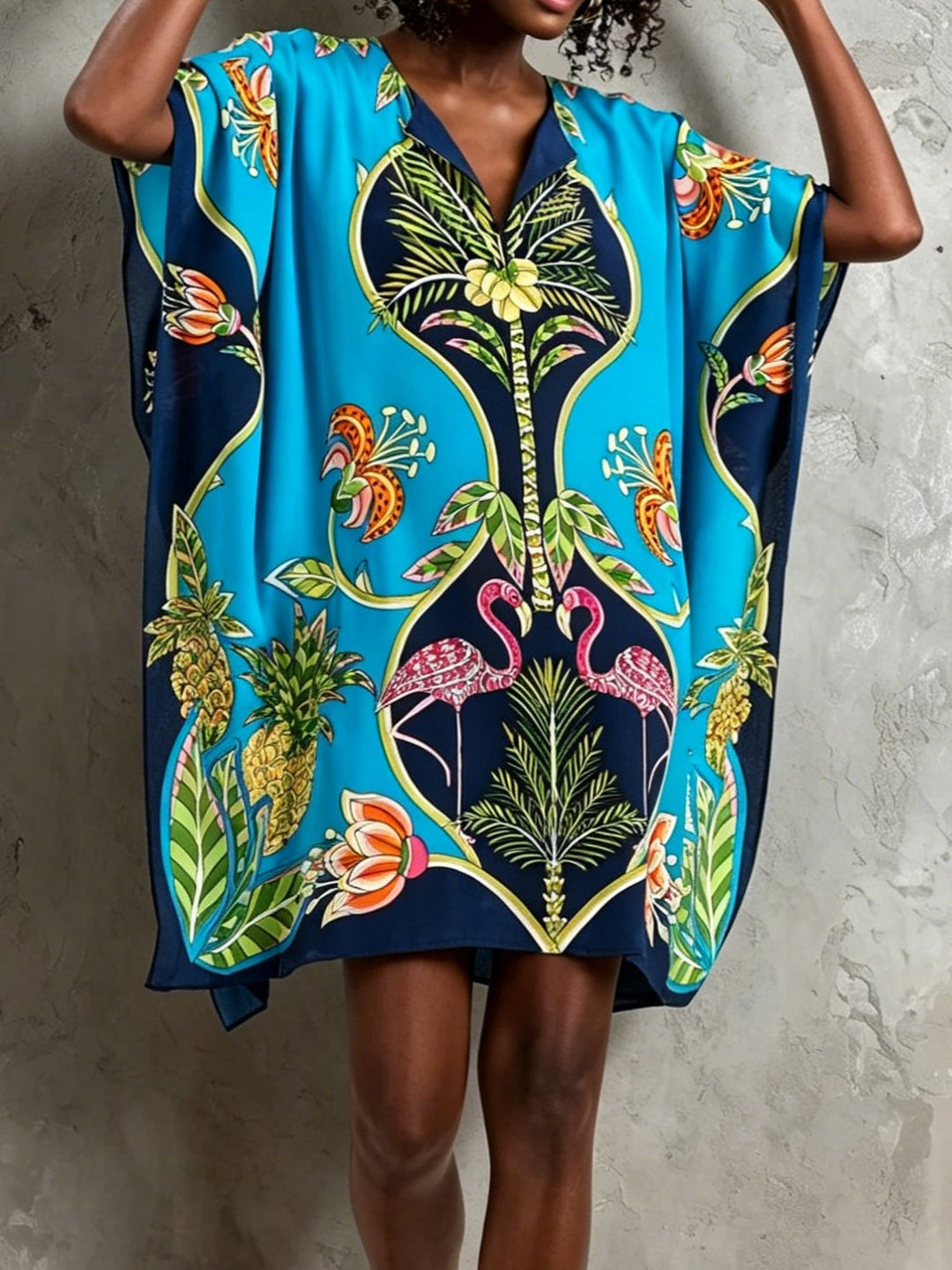 Elegant women's tropical print midi kaftan dress with a flattering V-neck and stylish batwing sleeves.