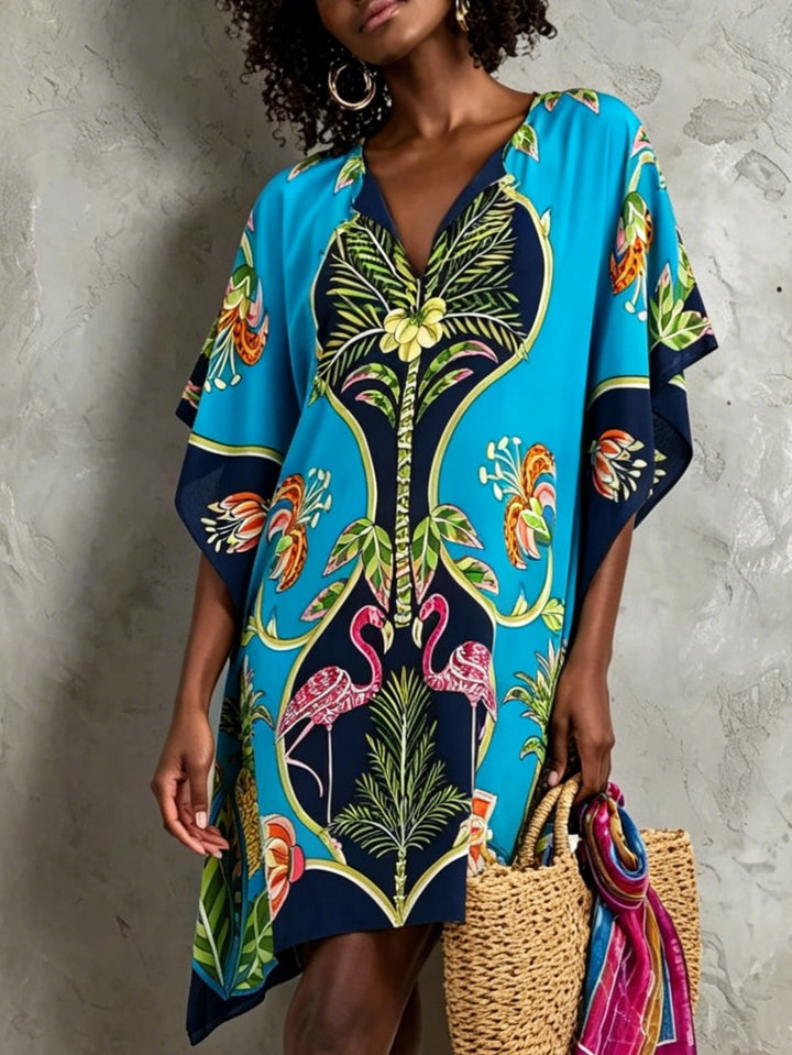 Comfortable women's tropical V-neck kaftan midi dress with batwing sleeves, versatile for beach or resort.
