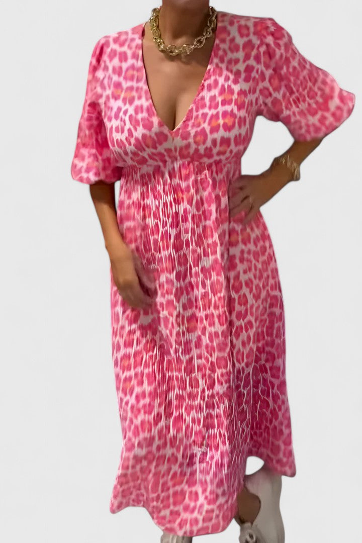 Elegant women's flowy tropical stripe maxi dress with V-neck, puff sleeves & empire waist, ideal for casual summer fashion.
