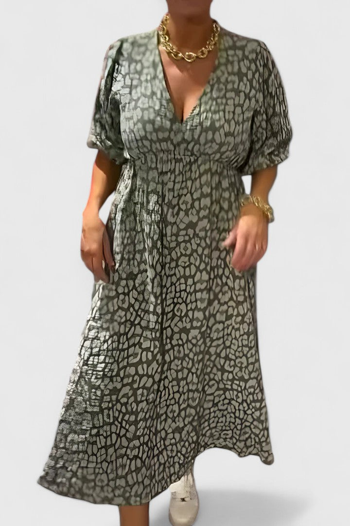 Colorful tropical stripe maxi dress for women, featuring a V-neck, puff sleeves & flowy fabric for comfortable resort wear.