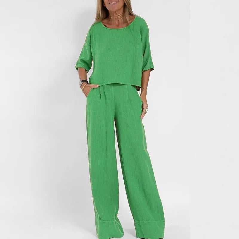 Coordinated two piece women's outfit: elegant boatneck top & wide leg trousers.