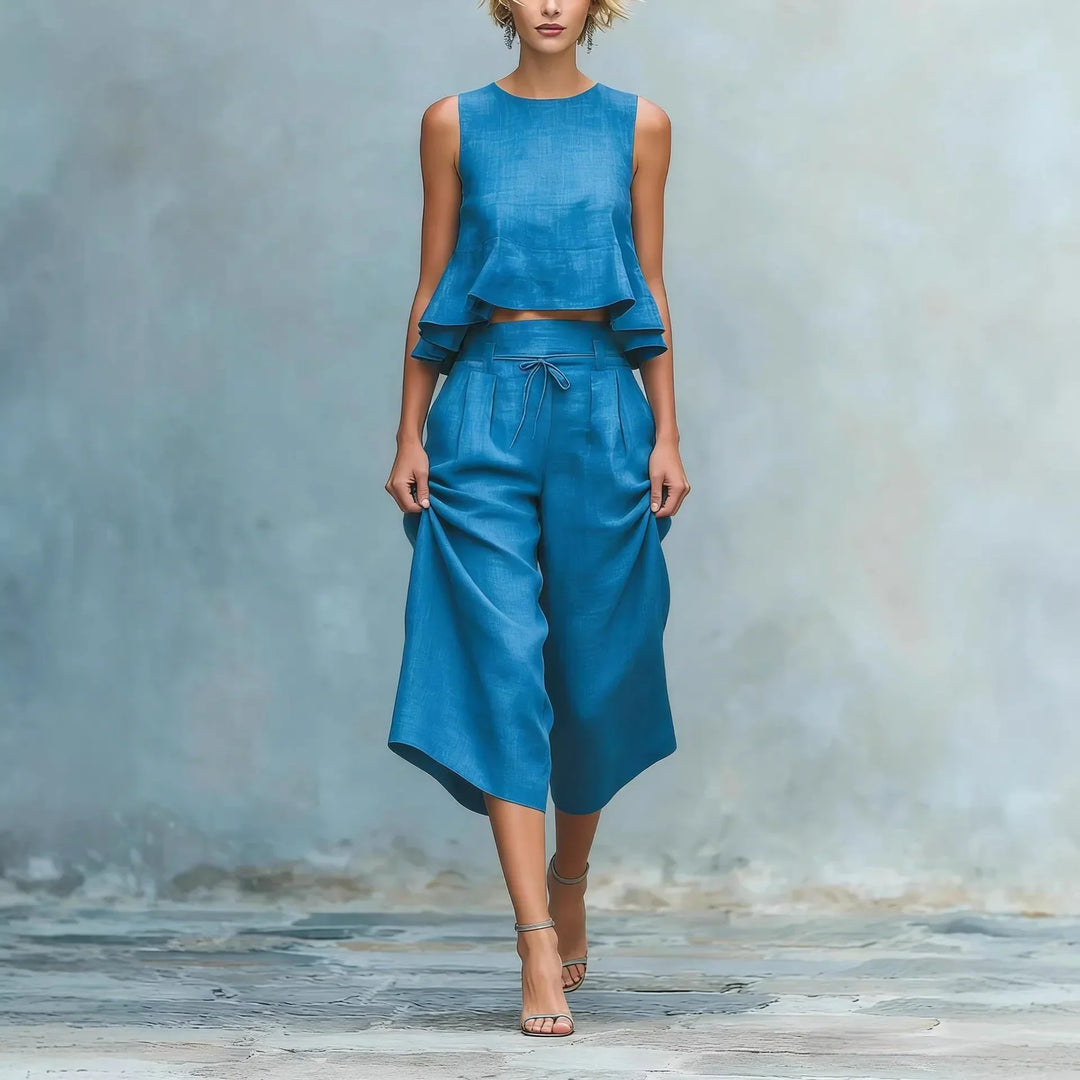 Women's two-piece crop top & high-waist wide leg pant set for elegant casual spring & summer fashion.