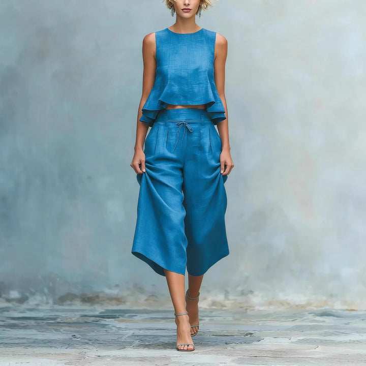Women's two-piece crop top & high-waist wide leg pant set for elegant casual spring & summer fashion.