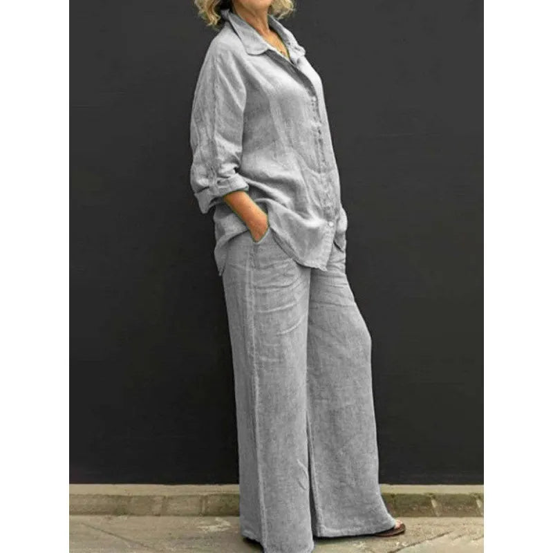 Model showcasing a women's two-piece set: button-up shirt and wide-leg trousers, a stylish spring outfit.
