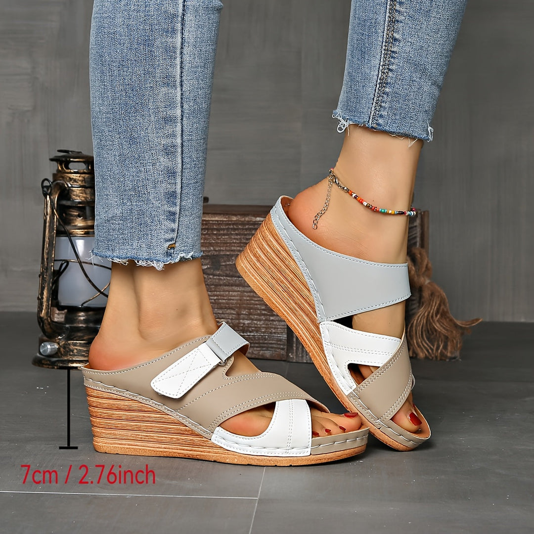 Close-up of women's two-tone wedge slides, highlighting comfortable open-toe design for summer.