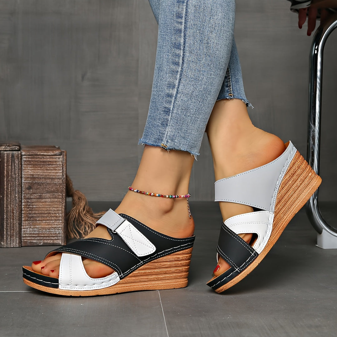 Elegant women's two-tone wedge slides, open-toe summer footwear for comfortable poolside style.