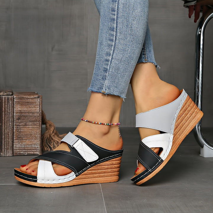 Elegant women's two-tone wedge slides, open-toe summer footwear for comfortable poolside style.