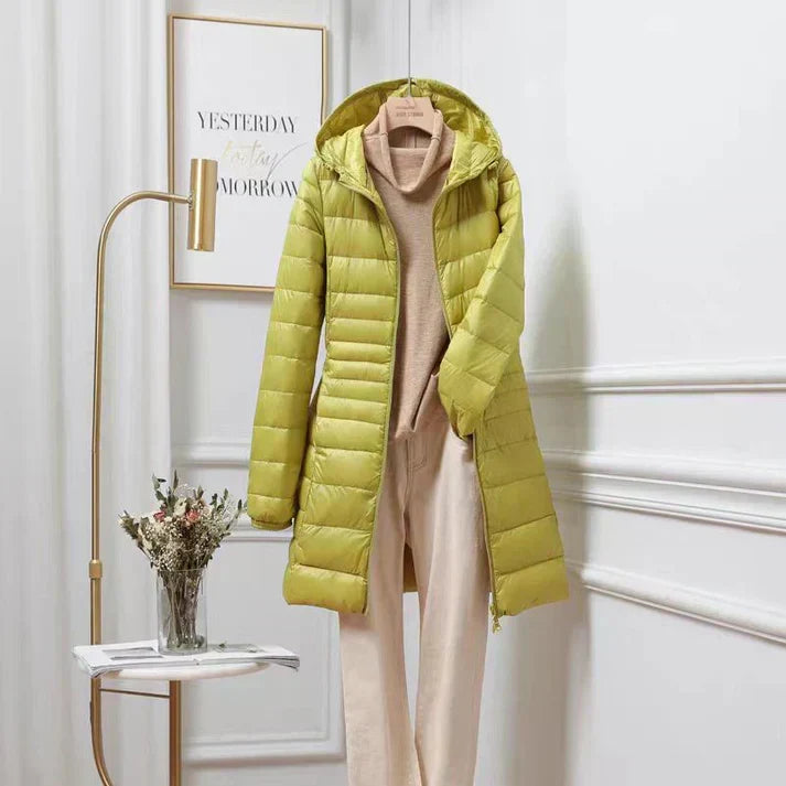 Women's ultra-light insulated hooded jacket, perfect for travel & transitional weather. Packable & warm.
