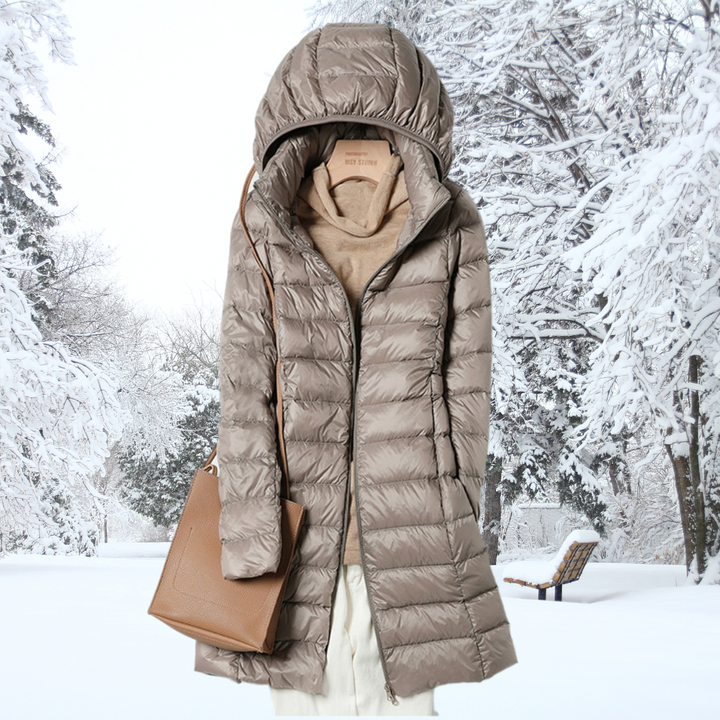 Woman wearing a stylish ultra-light insulated hooded jacket, ideal for fall fashion & everyday outerwear.