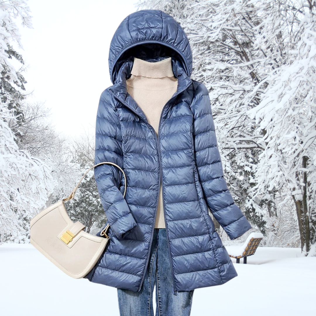 Close-up of the ultra-light insulated fabric on a women's hooded jacket, offering warmth without bulk.