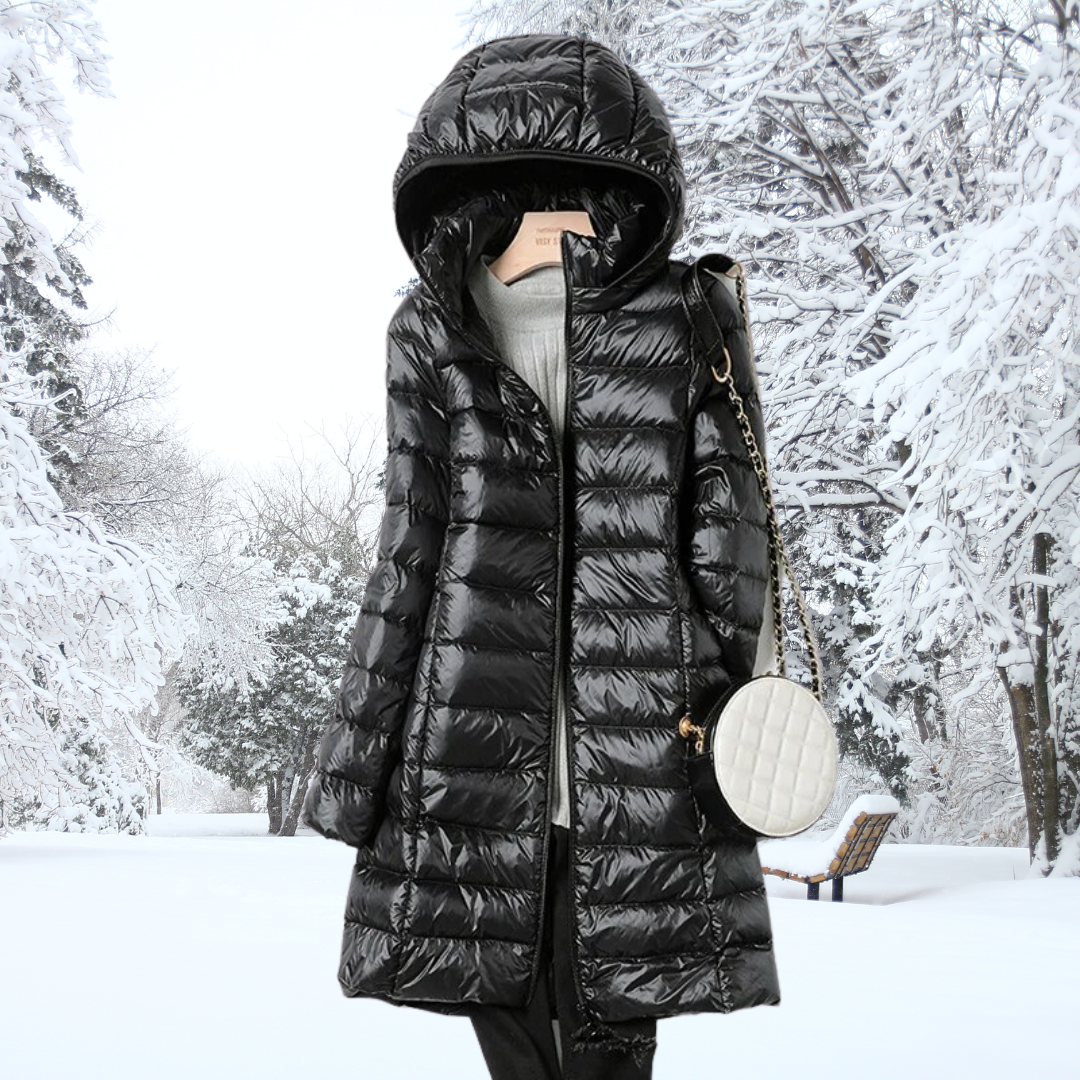 Packable women's ultra-light insulated hooded jacket, shown folded into its travel pouch for convenience.
