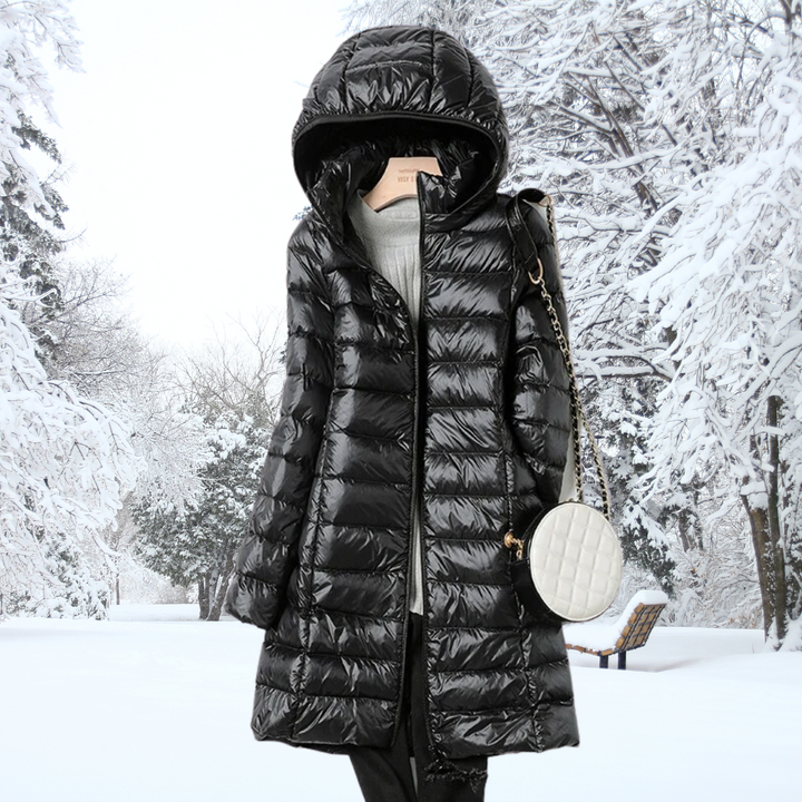 Packable women's ultra-light insulated hooded jacket, shown folded into its travel pouch for convenience.